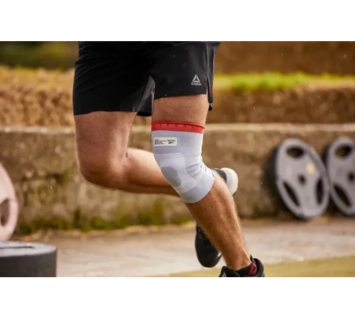 Бандаж для коліна Reebok Speedwick Knee Support розмір M, біло-червоний