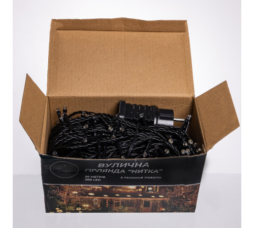 Гірлянда-нитка вулична Різдвяна фея 300 LED, 30 м, від мережі, чорний кабель, жовтий